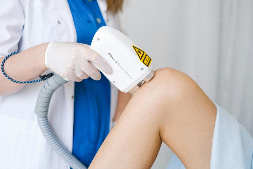 a doctor working on laser hair removal in apollo beach fl on a patient